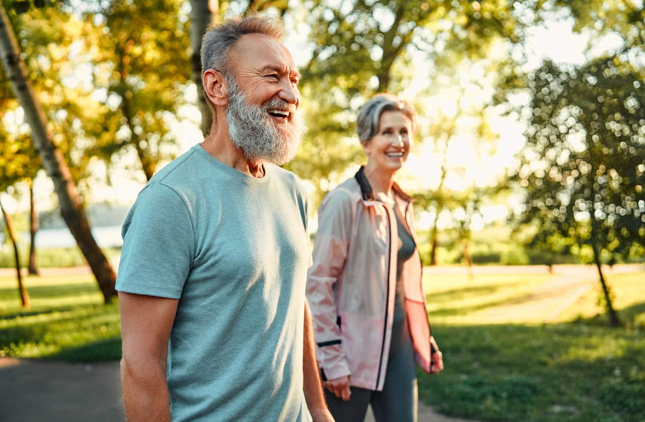 man and woman walking down path