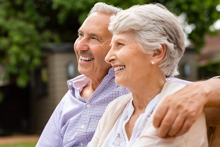 A couple sitting together smiling