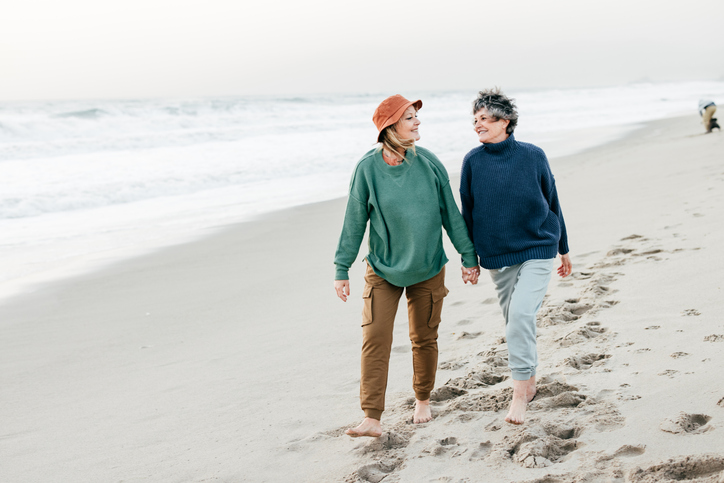 Senior women walking on the beach